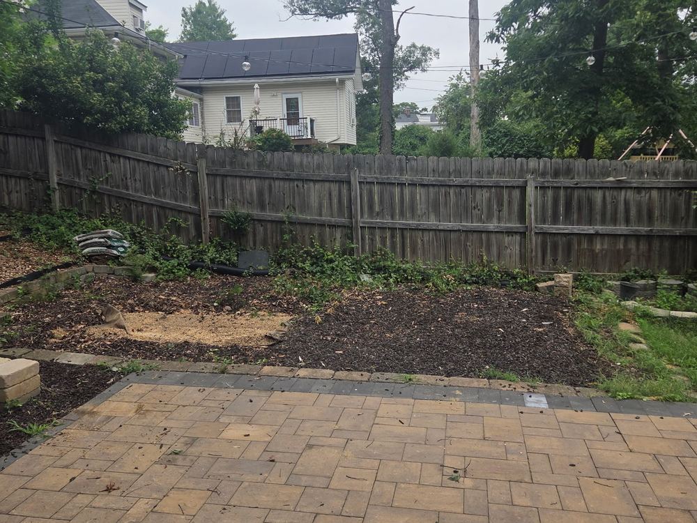 Cleared mulch beds and paver patio after the playset and swing set removal in Fairwood, Bowie, MD