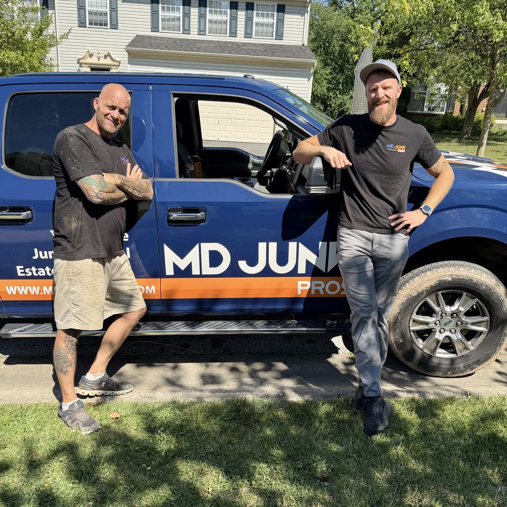 Chris and Wayne, the brothers behind MD Junk Pros, with their wrapped junk removal truck in Maryland