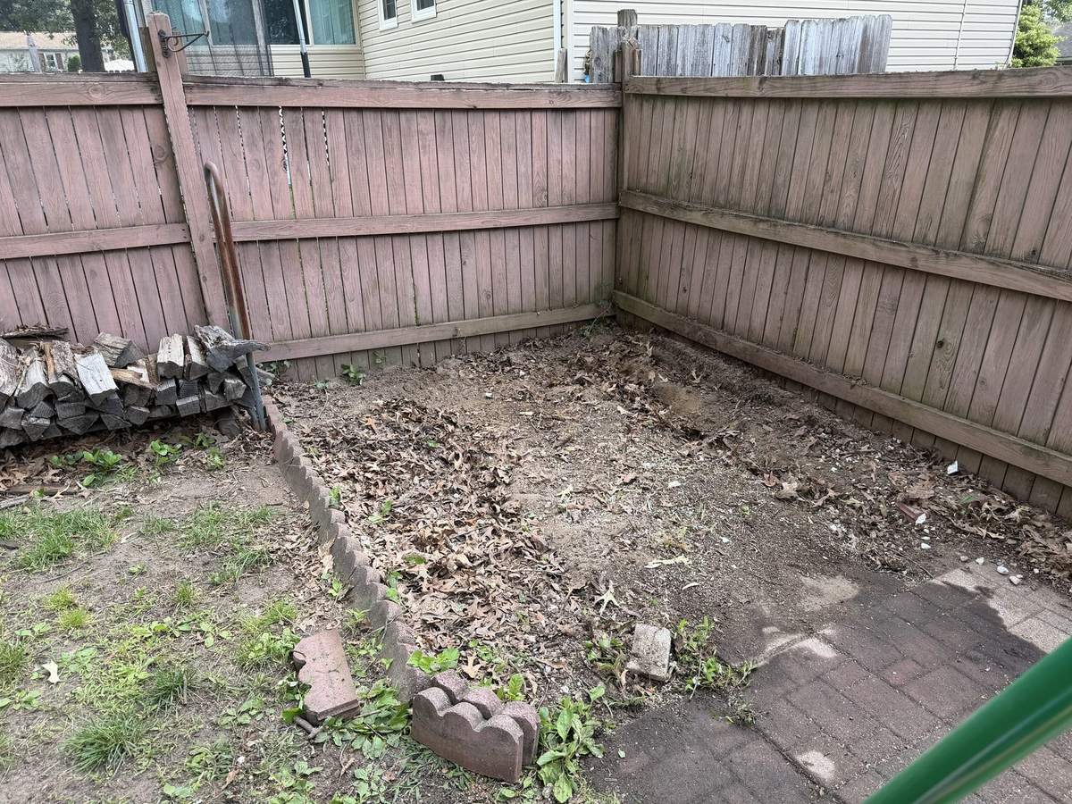 Empty backyard corner after hot tub removal and haul away in Severna Park, MD